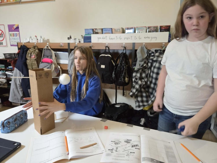 Fifth graders are learning the engineering design process and how to use Earth's resources wisely by construction their own windmills! Each group had a successful windmill able to lift a weighted bucket.