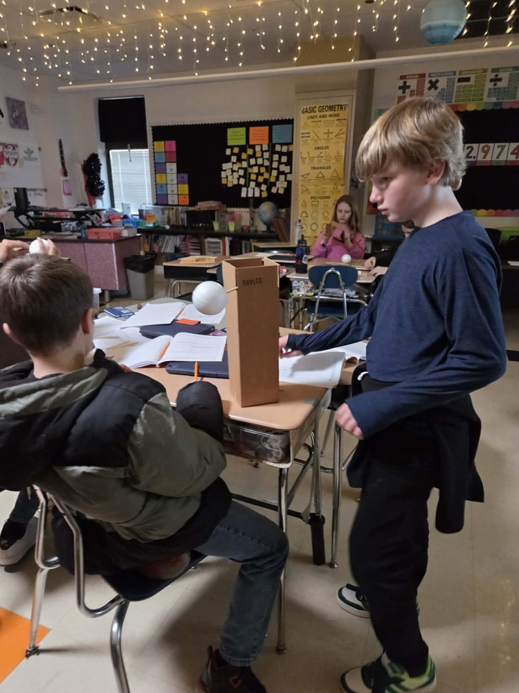 Fifth graders are learning the engineering design process and how to use Earth's resources wisely by construction their own windmills! Each group had a successful windmill able to lift a weighted bucket.
