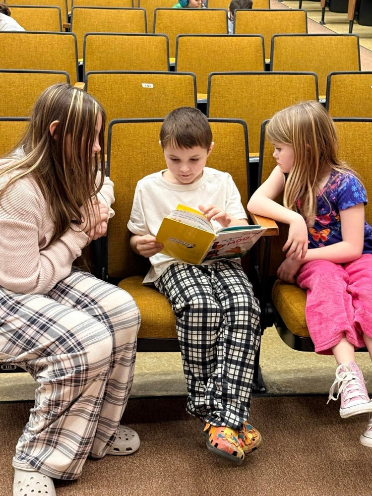 In pajamas they came, with partners to meet, With books in their hands and socks on their feet! From Kindergarten buddies to Fifth Grade pros, Reading together is how Sheffield grows!