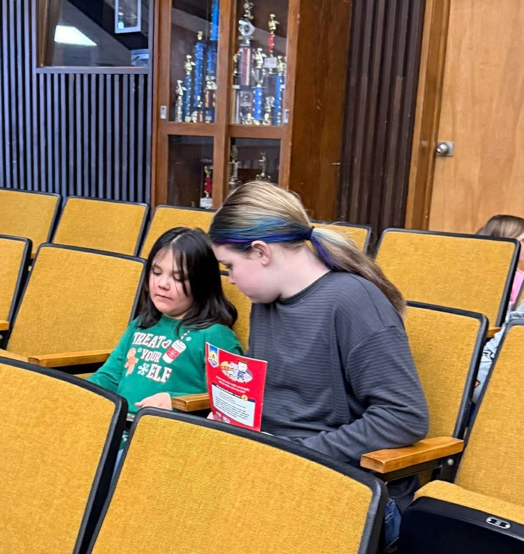In pajamas they came, with partners to meet, With books in their hands and socks on their feet! From Kindergarten buddies to Fifth Grade pros, Reading together is how Sheffield grows!