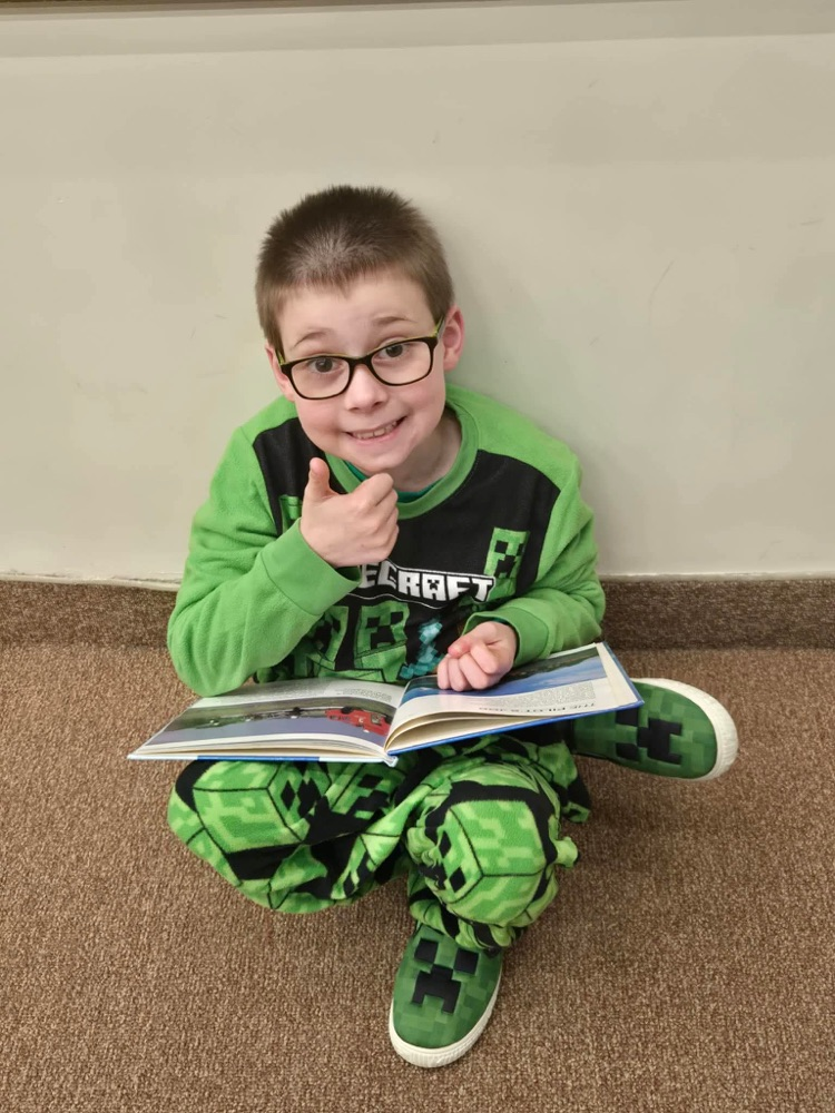 In pajamas they came, with partners to meet, With books in their hands and socks on their feet! From Kindergarten buddies to Fifth Grade pros, Reading together is how Sheffield grows!
