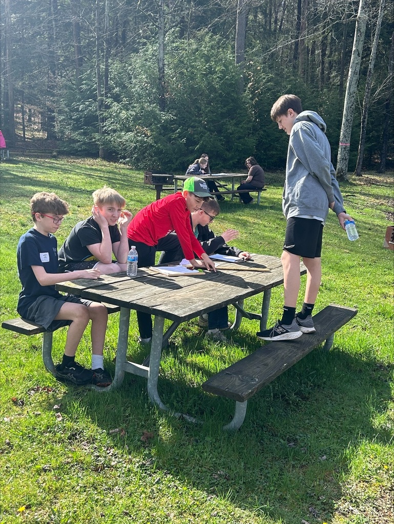 WCSD Envirothon team working at a station