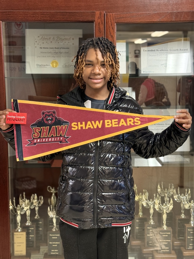 Semaj Riddick holding Shaw University flag