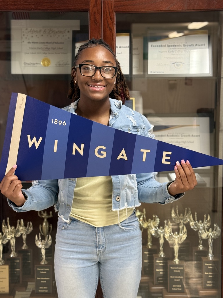 Kenley holding Wingate University flag