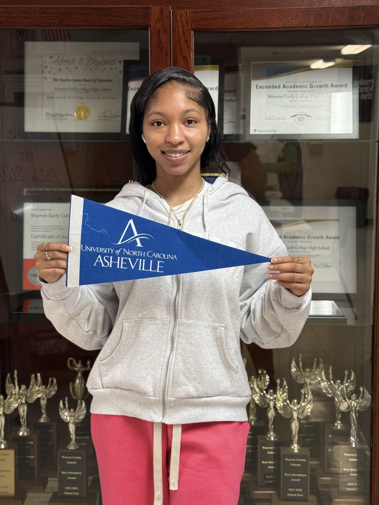 Jakyra holding UNCA flag