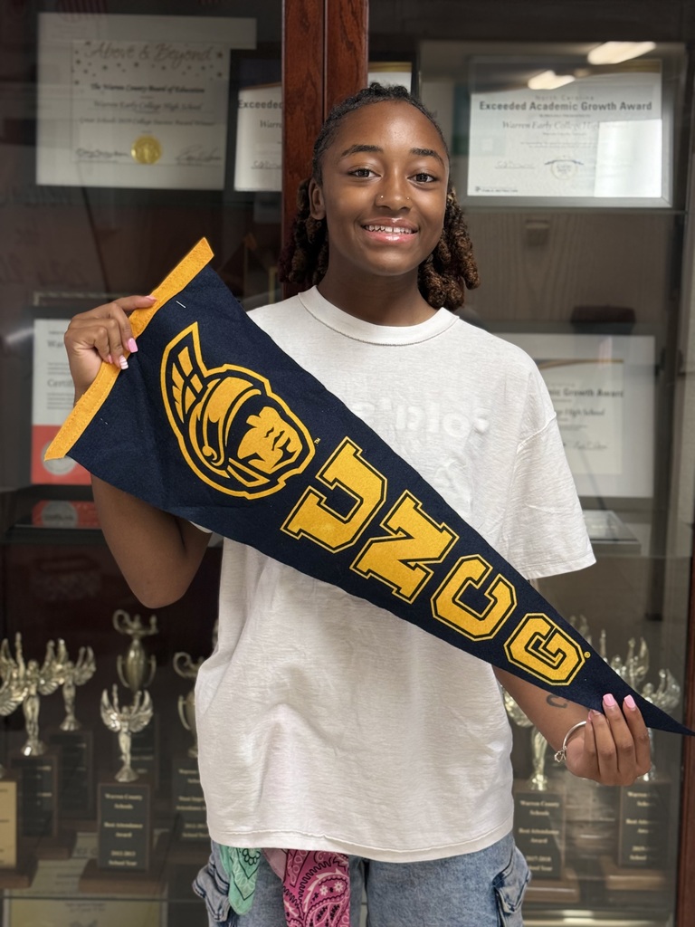 Kenley holding UNCG Flag