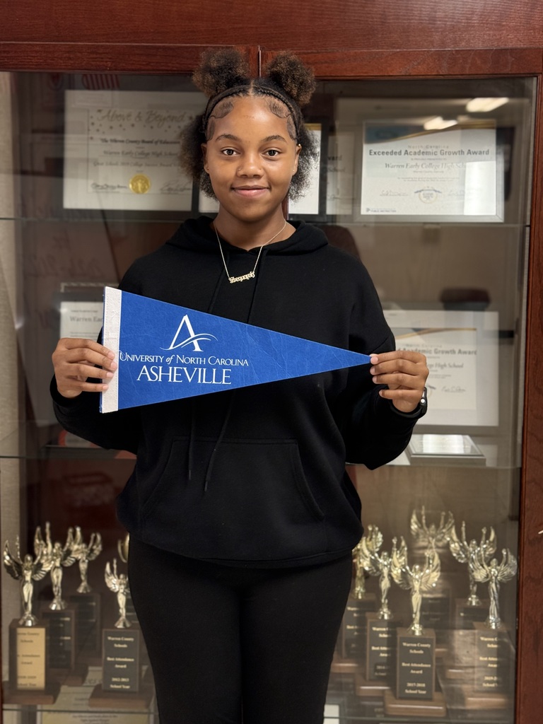 Sequoyah holding UNC-Asheville flag