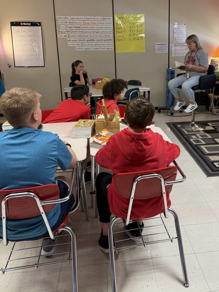 Students listening to teacher read