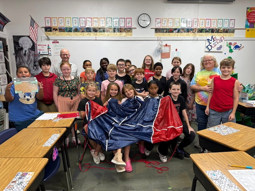 5th grade class in classroom with deflated weather balloon