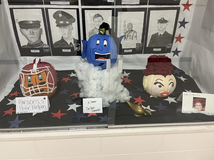 pumpkins decorated as a Football player, genie and witch