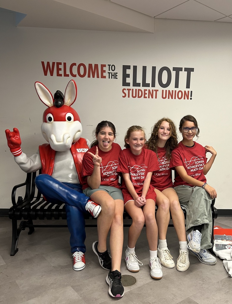 people sitting with a mascot