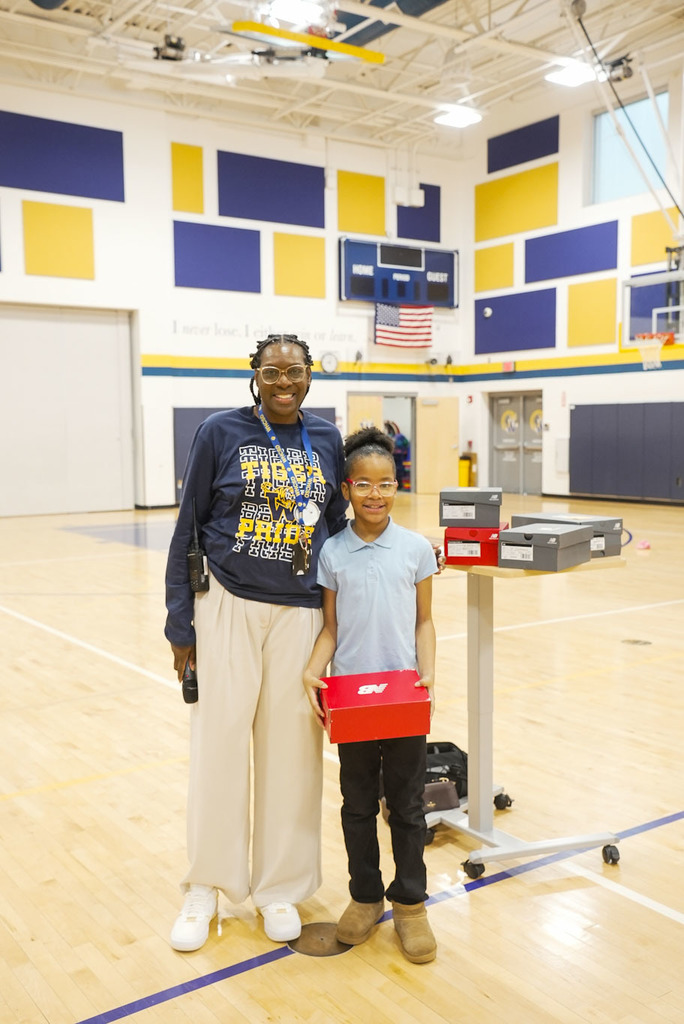 student receiving a prize for attendance 