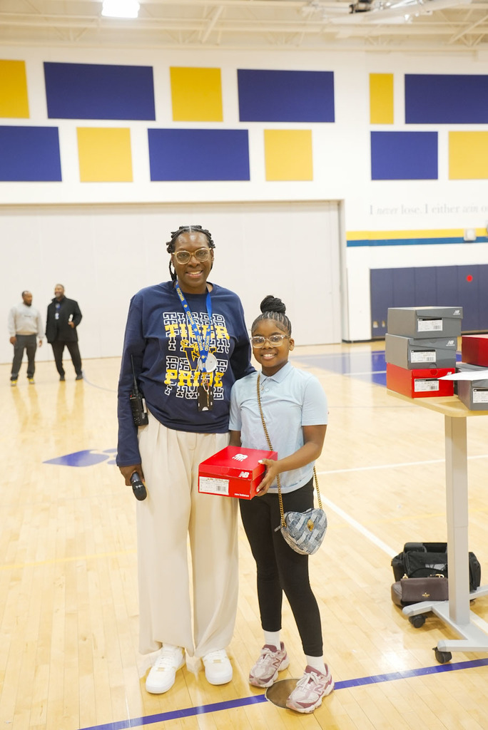 student receiving a prize for attendance 