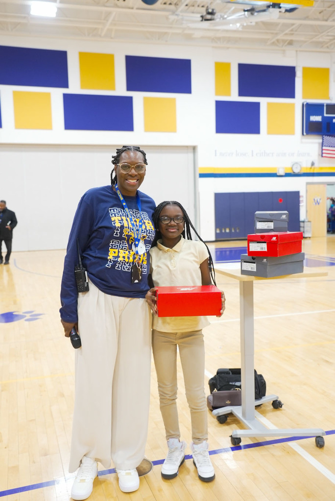 student receiving a prize for attendance 