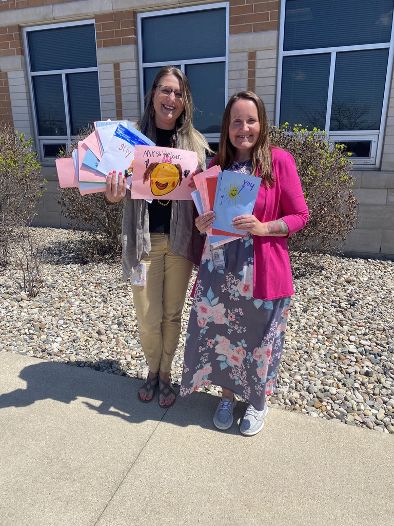 Miss Charity and Ms. Weber with letters from students