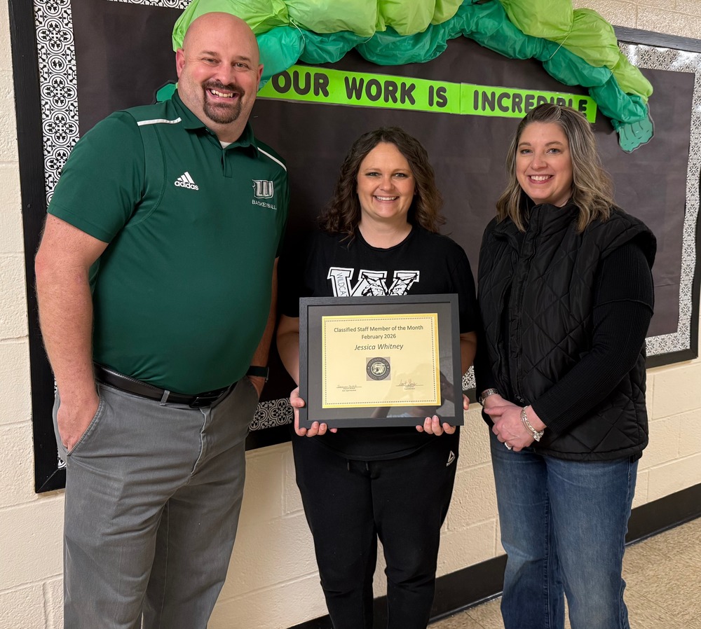 Ms. Whitney accepts award