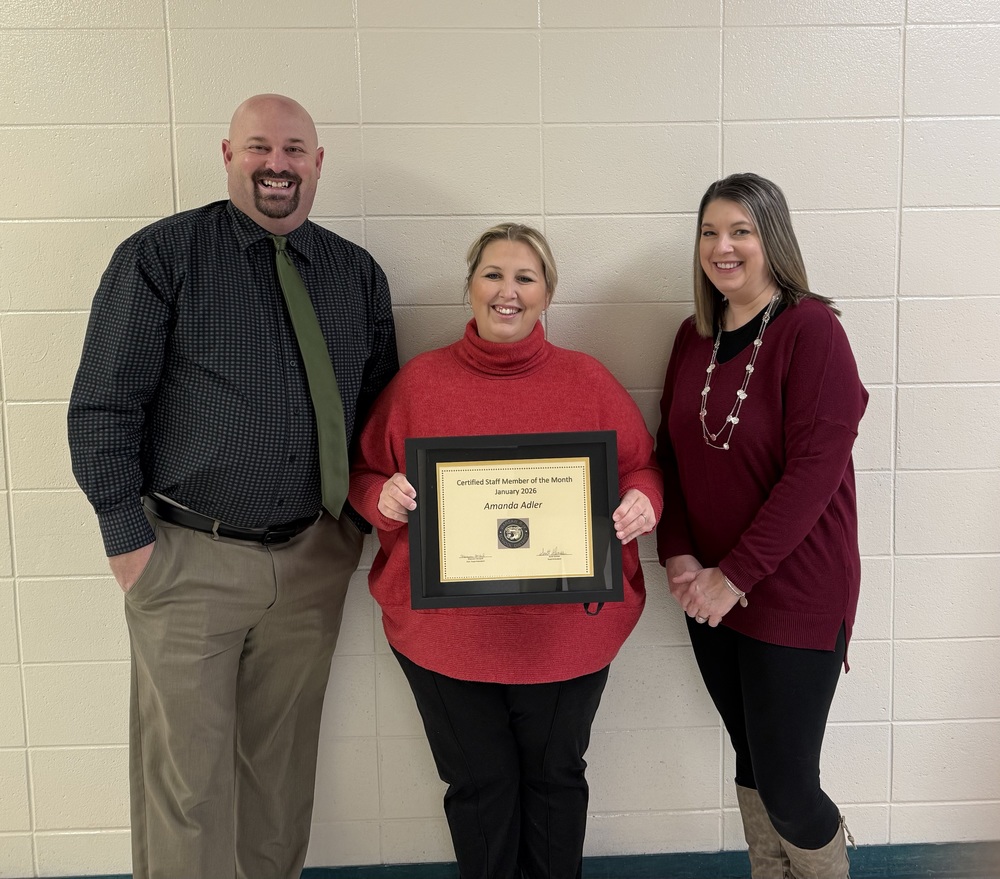 Mrs. Adler accepts award. 