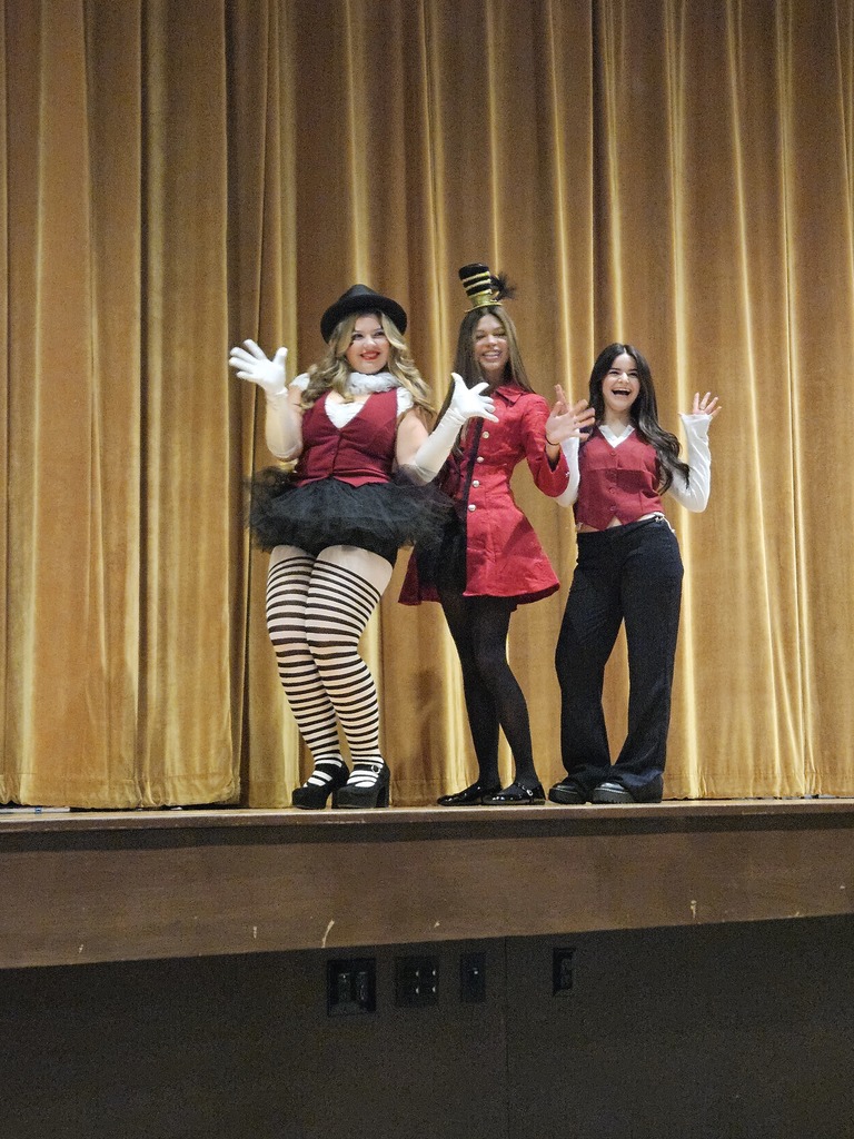 Students dressed in maroon and black outfits like Panic at the Disco album cover