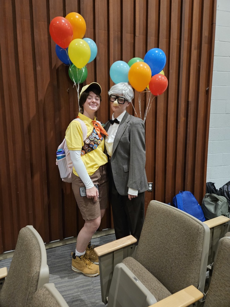 Students dressed as characters from Up with balloons tied to their backs