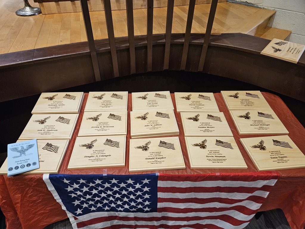 Table with wooden plaques for the Veterans and the American Flag
