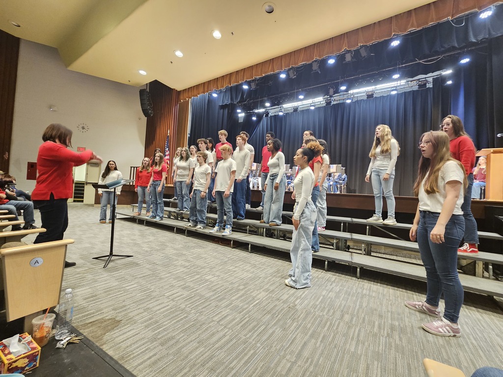 Pilgrim chorus on the risers in front of the stage
