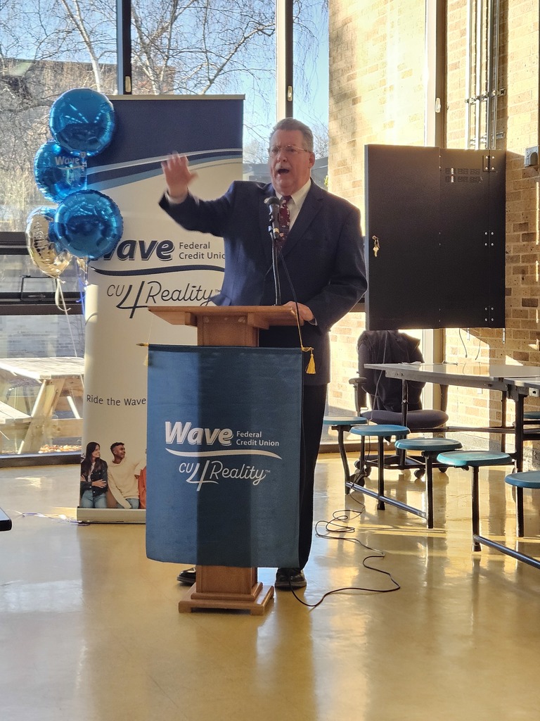 Mr. McKenney talking at a podium