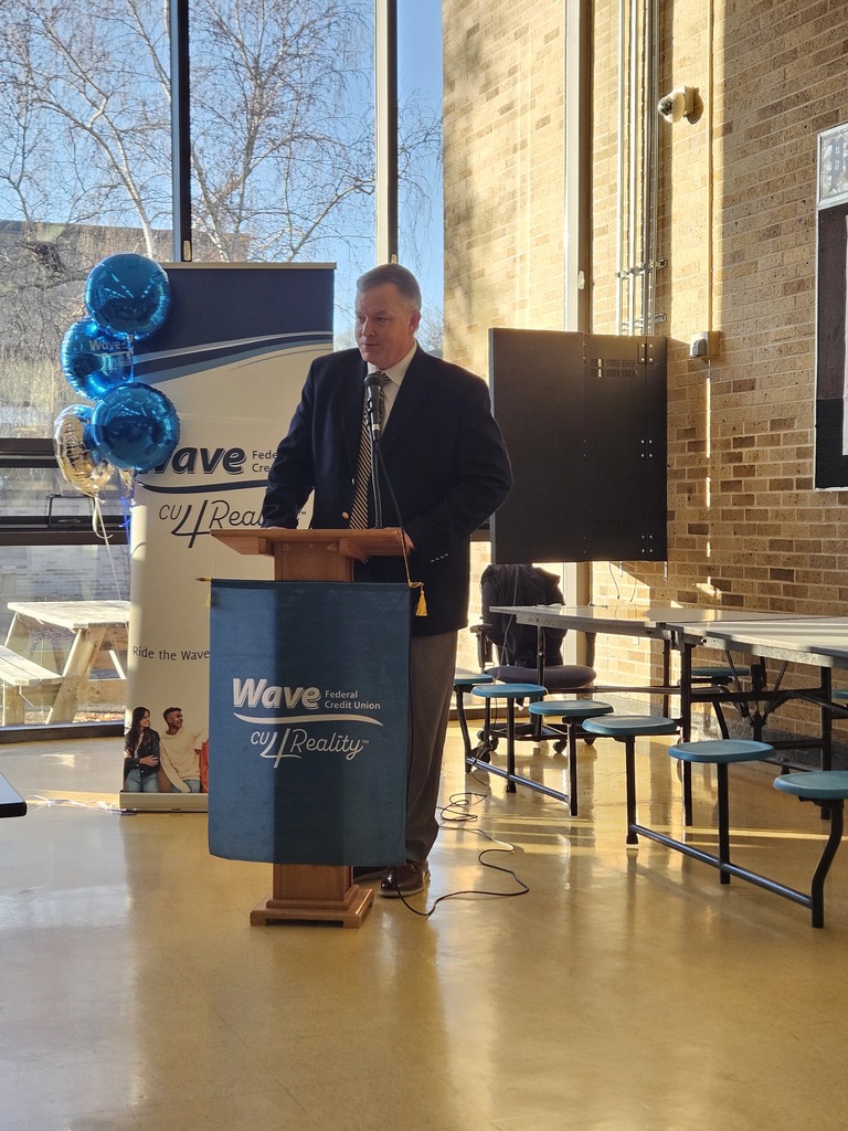 Mr. McCaffrey talking at a podium