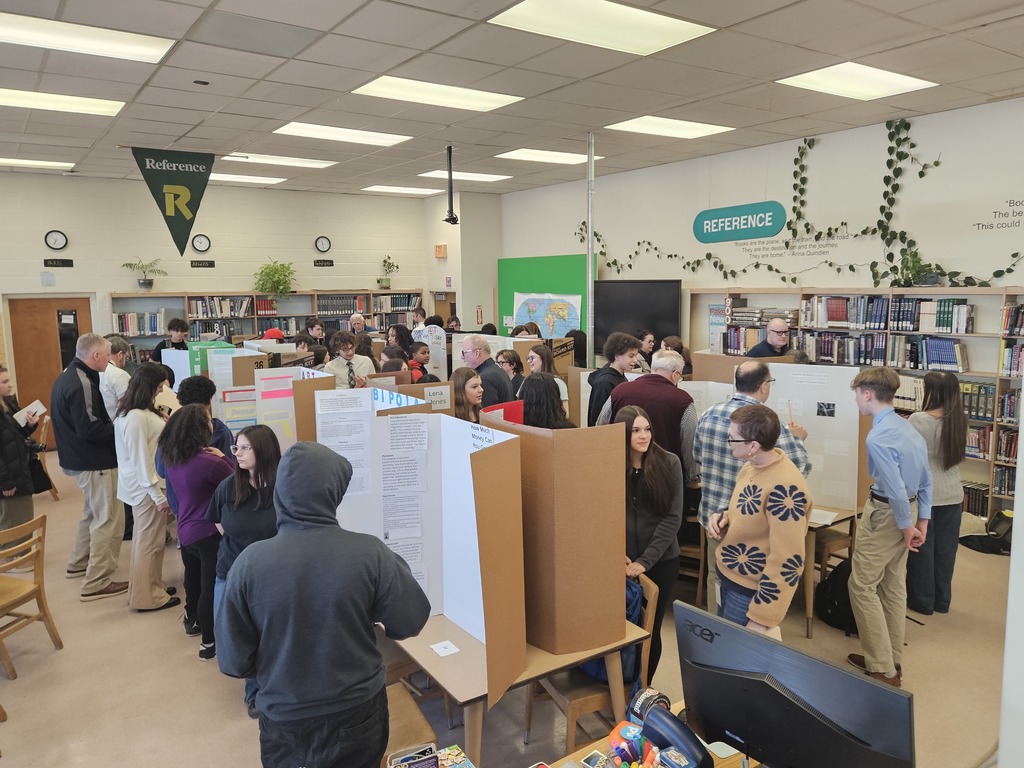 Students and judges talking about the projects