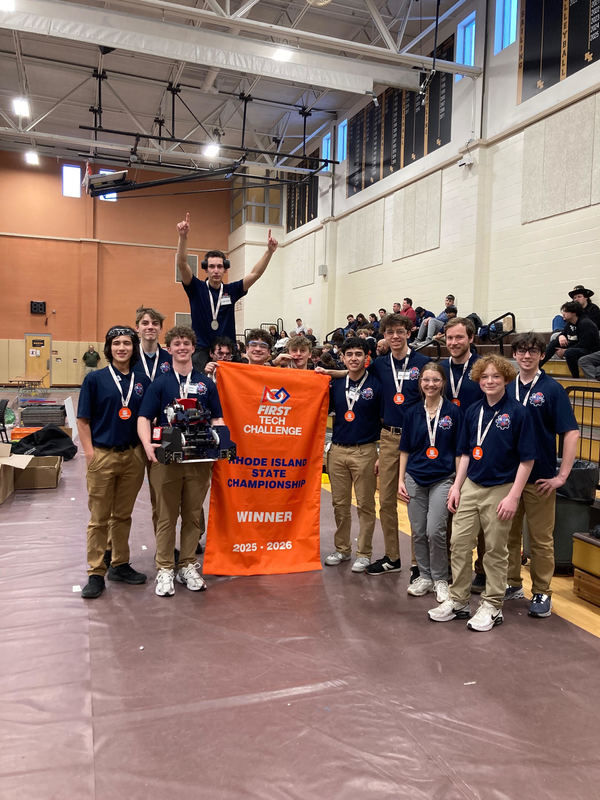 Robo-Titans posing with banner