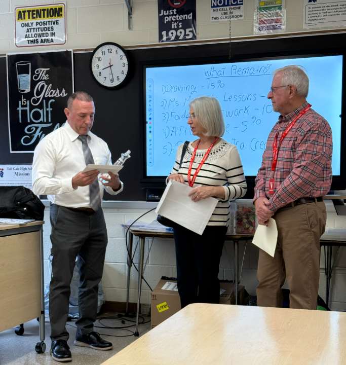 Mr. Hagopian posing with Mr. and Mrs. Burke