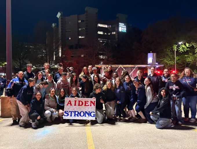 students with sign - "Aiden Strong"