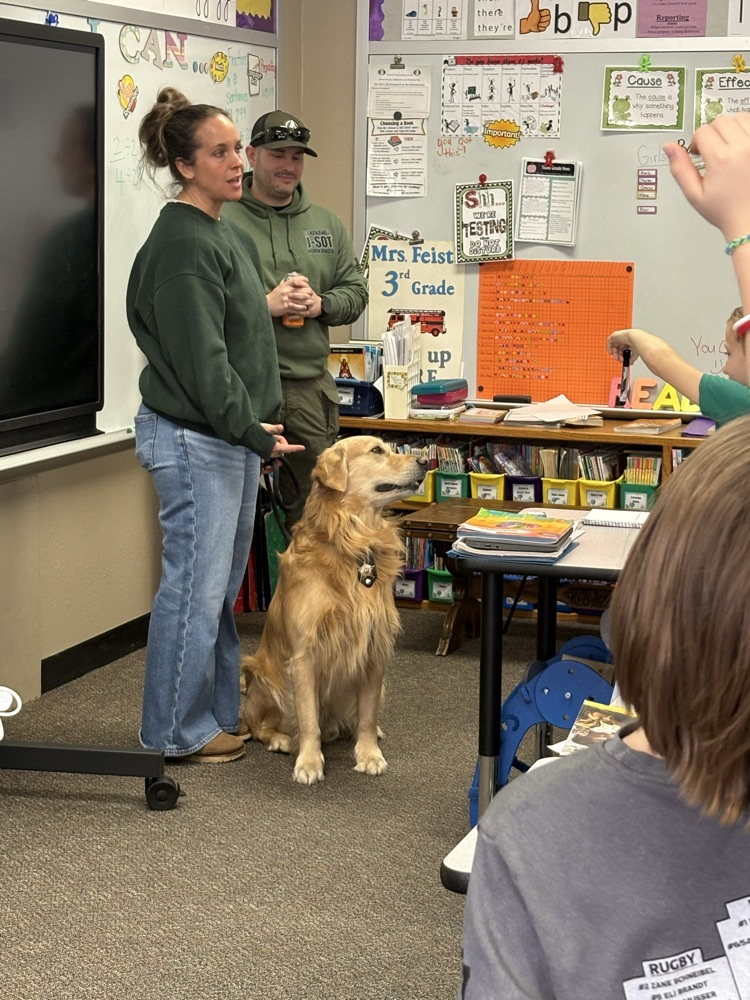 Explaining how K9 Charlie does his job. 