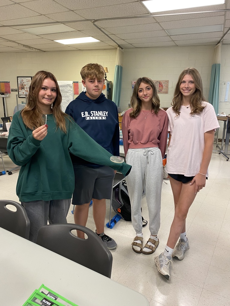 Students inoculate a Petri dish.