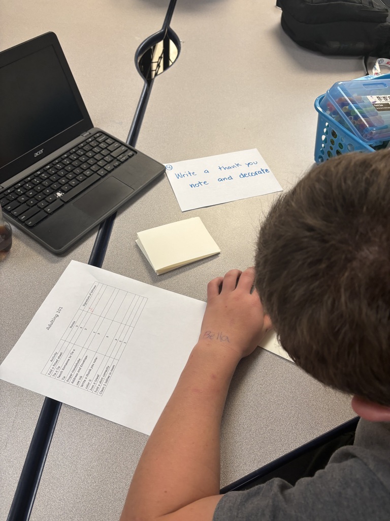 A student writes a thank you note.