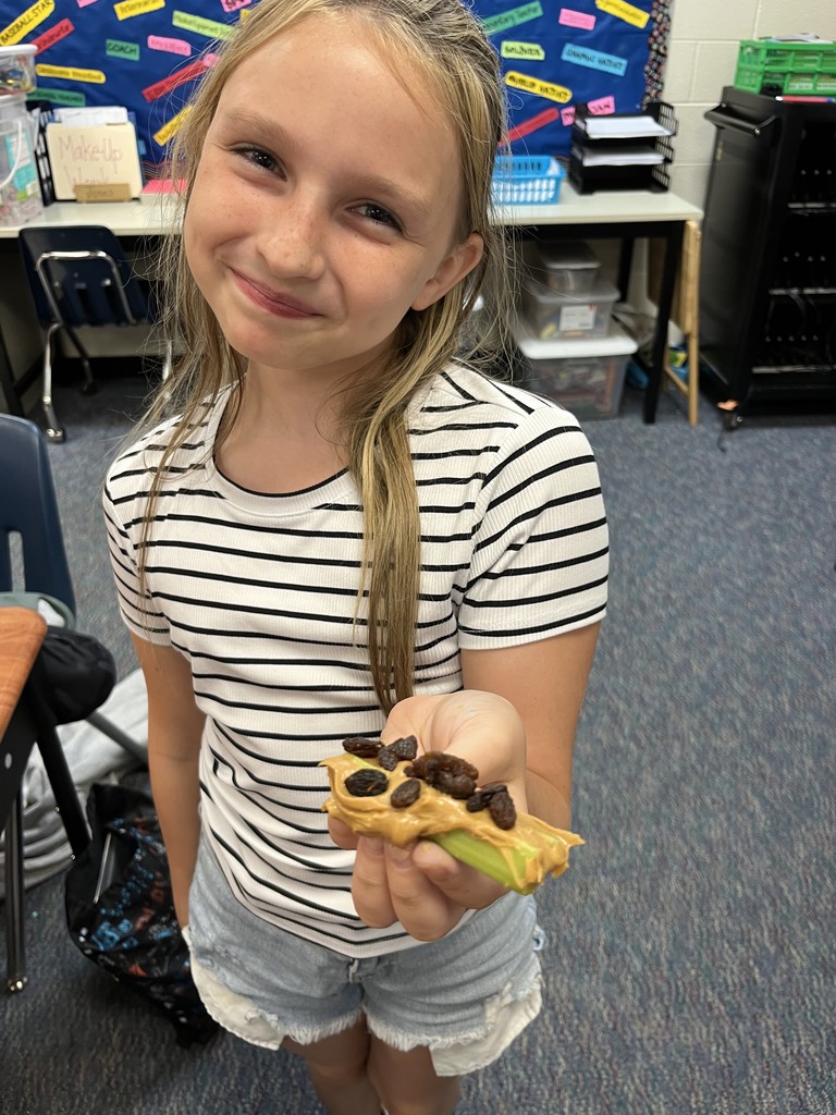 In science class, students in Mrs. Jones’ class investigated with celery to explore how water is transported throughout the plant. After this investigation, students enjoyed a snack entitled “Ants on a Log”. It was a delicious way to learn!