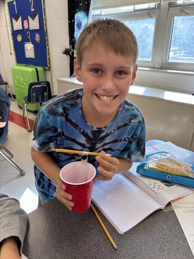 A student does an experiment with water.