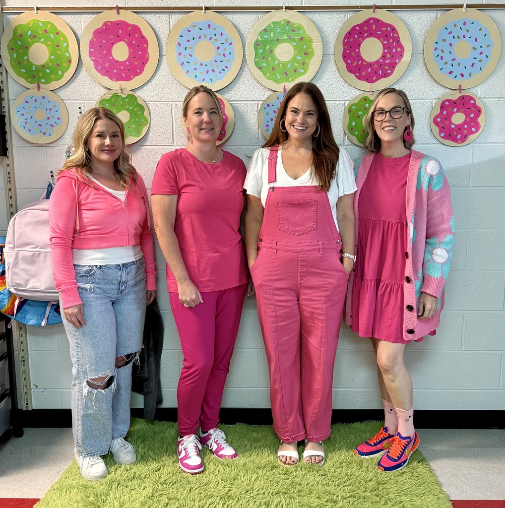 A group of people wear pink for Homecoming dress-up days.
