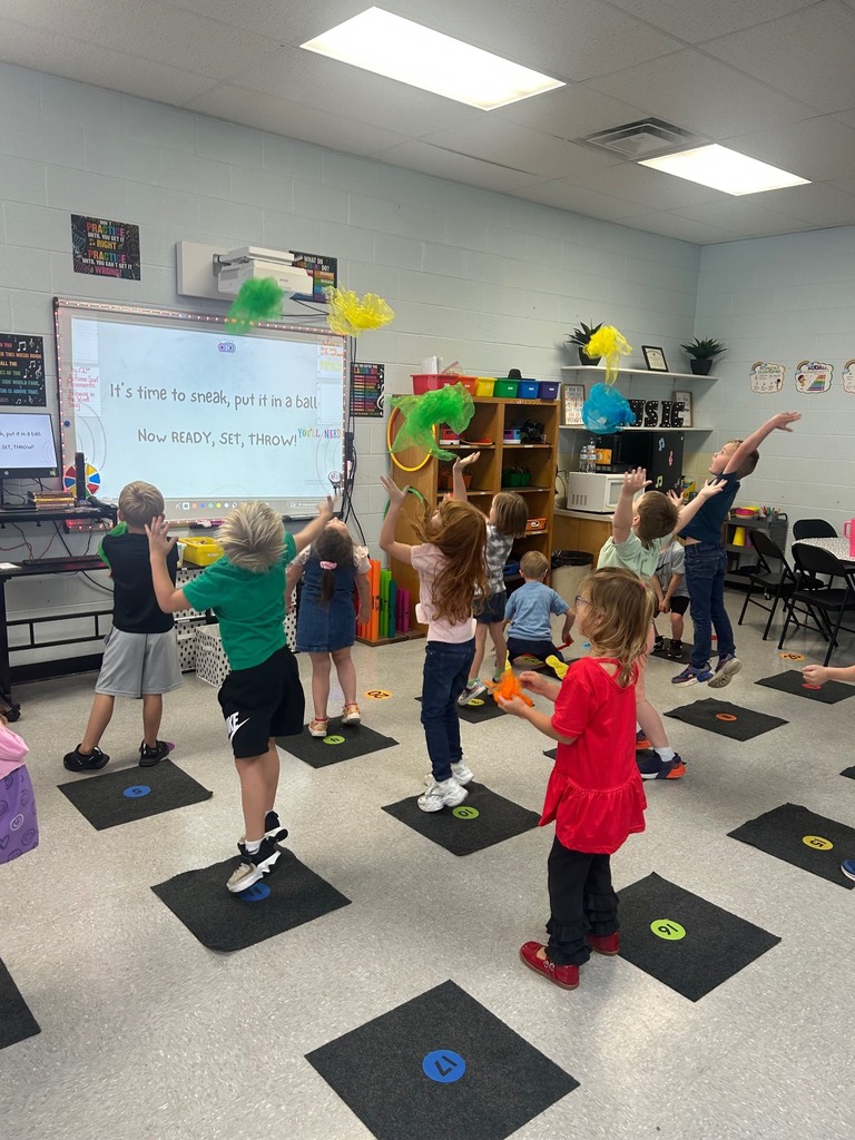 Students in Ms. Morrow’s class learning a song called " Blowing in the Wind." Students acted out the lyrics to the song by moving their scarves to the music.