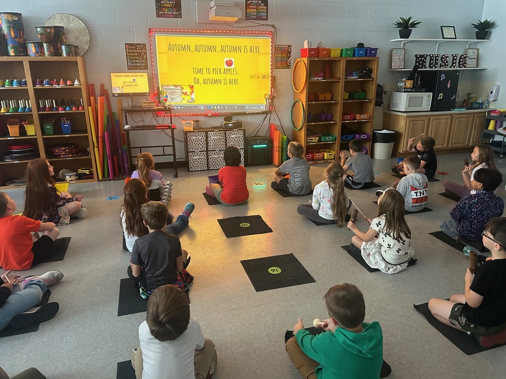 Students from Mrs. McCall’s class learning a song called " Autumn is Here." Students used the instruments such as the woodblock, hand drums, guiros, maracas, sleigh bells, and triangles to play along with the lyrics of the song.