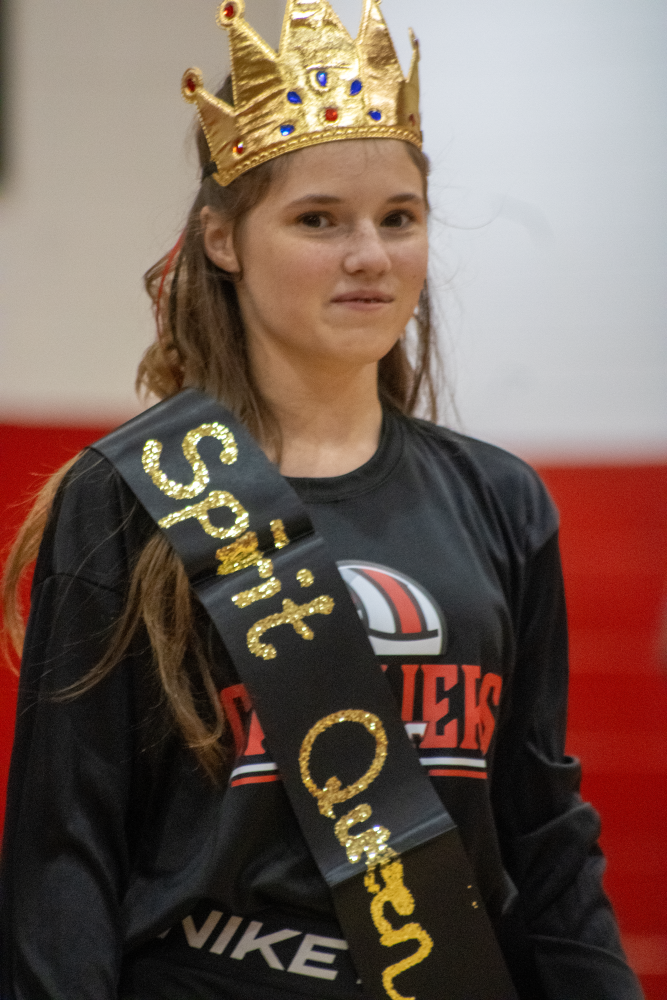 A student wears a crown.