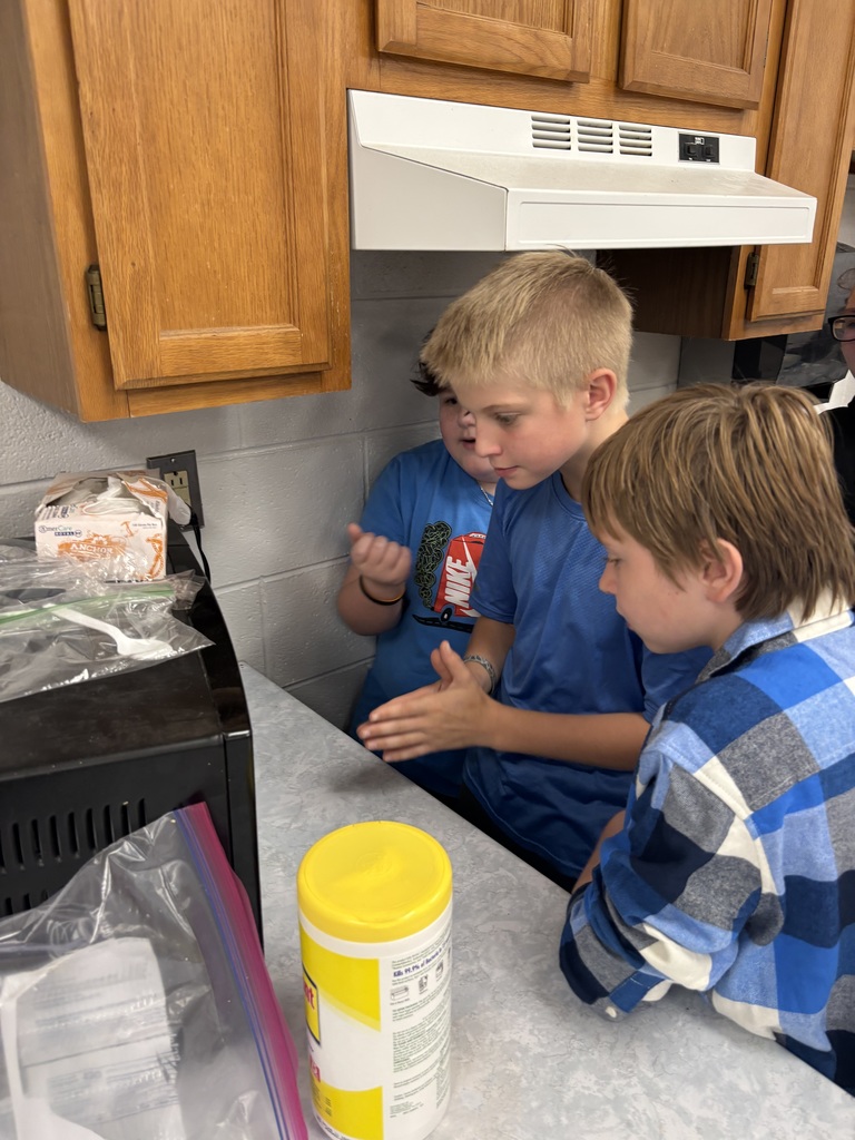 Students pop popcorn in a microwave.