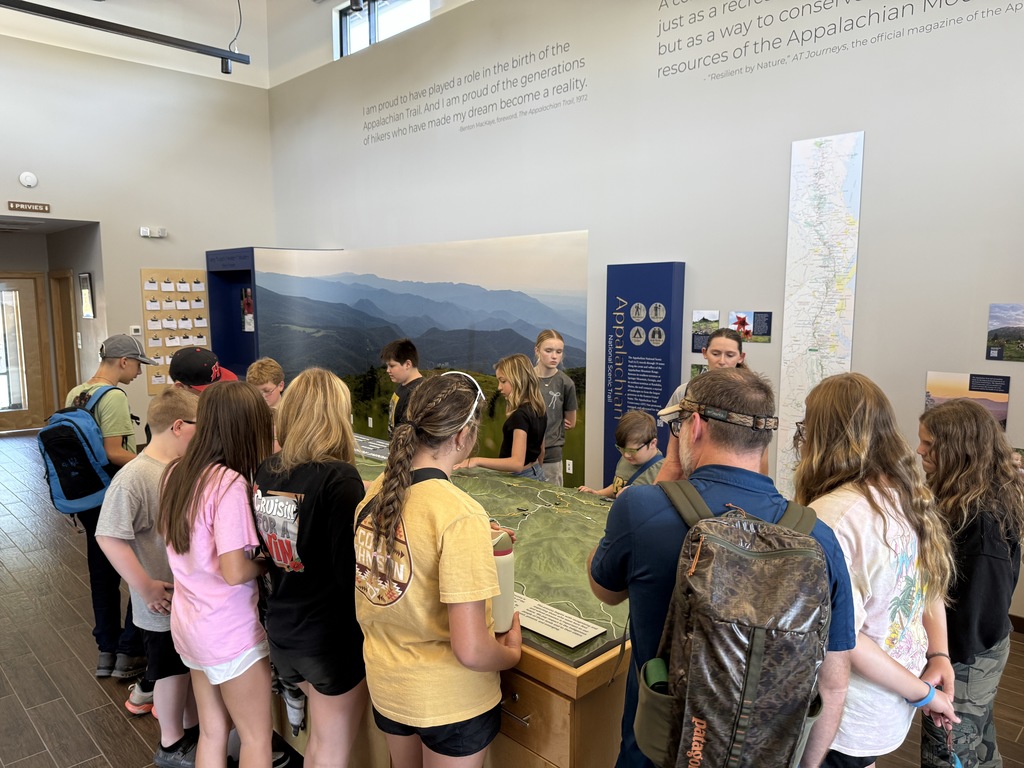 Students look at a model of the Appalachian Trail.