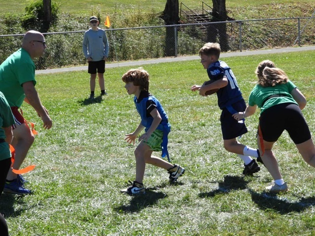 Students playing flag football.