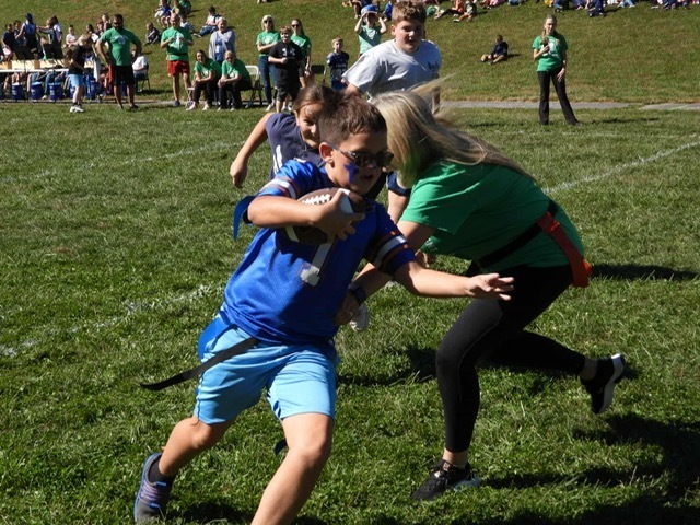 Students playing flag football.