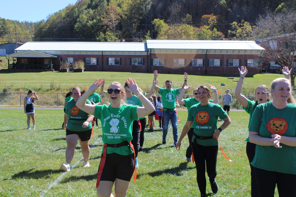 Teachers playing flag football.