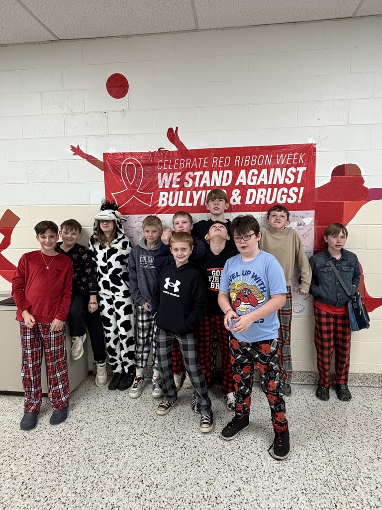Students pose in their pajamas.