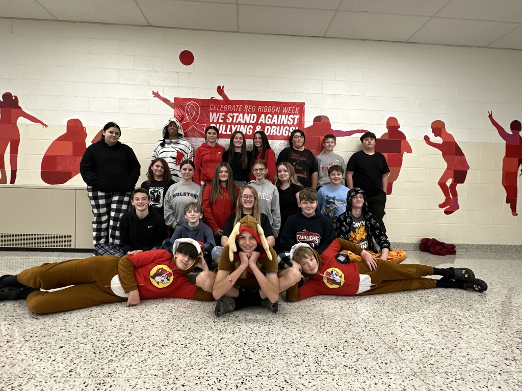 Students pose in their pajamas.