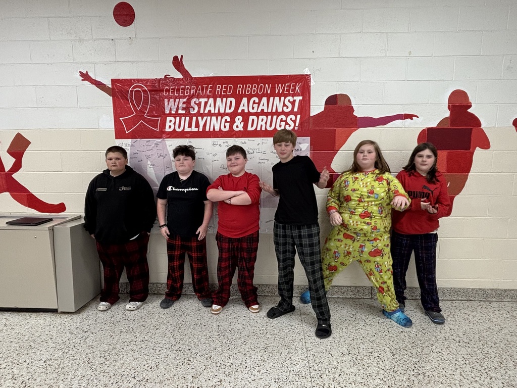 Students pose in their pajamas.