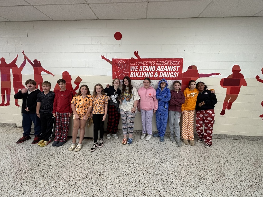 Students pose in their pajamas.