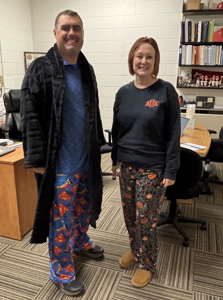 Principals pose in pajamas.